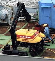 Unmanned submersible vessel loaded on salvage ship